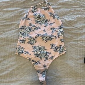 pink and blue flower bodysuit